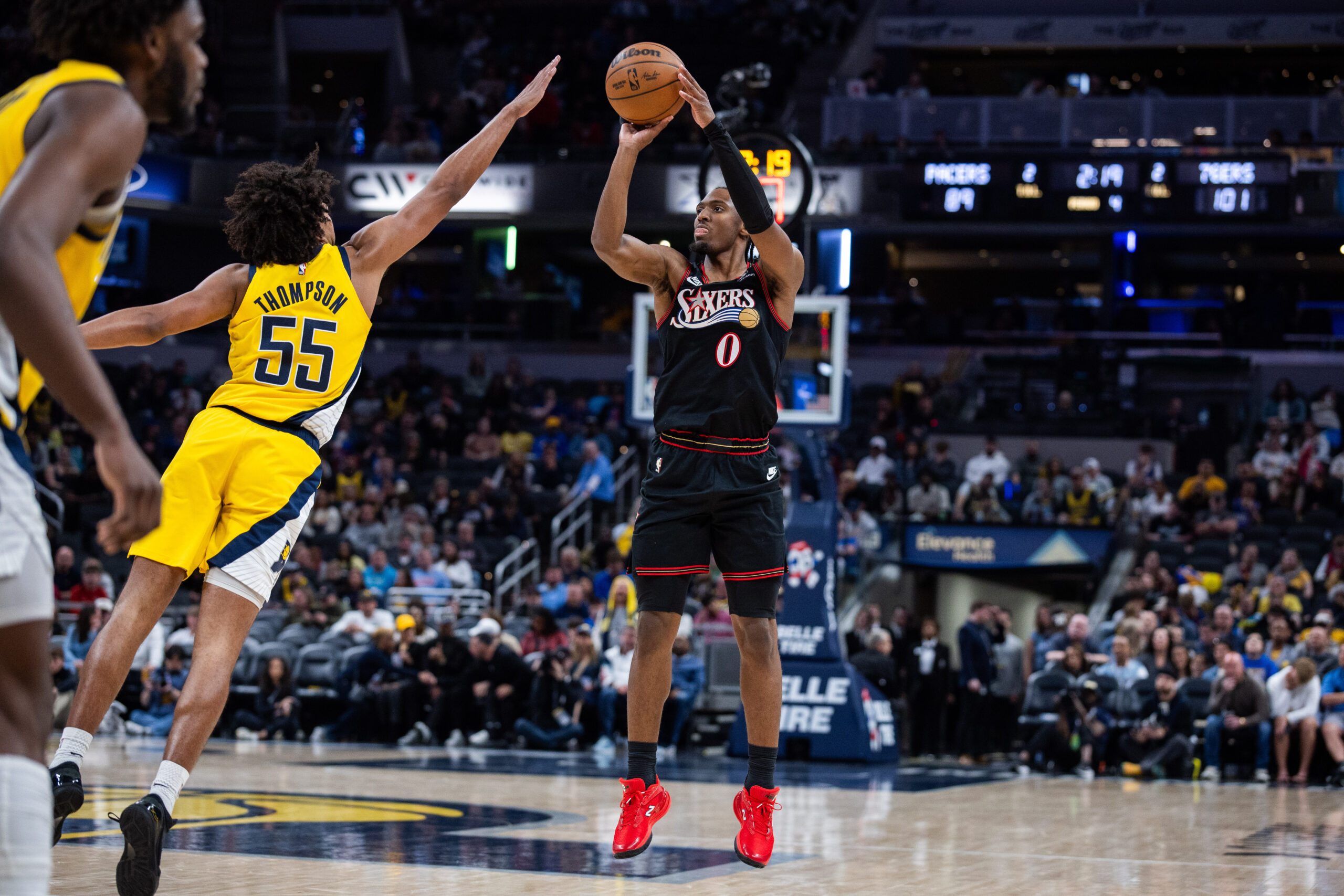 Apr 10, 2026; Indianapolis, Indiana, USA; Philadelphia 76ers guard Tyrese Maxey (0) shoots the ball while Indiana Pacers guard Ethan Thompson (55) defends in the second half at Gainbridge Fieldhouse. Mandatory Credit: Trevor Ruszkowski-Imagn Images