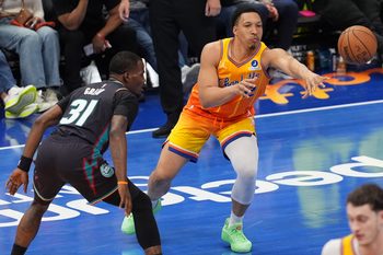 Apr 10, 2026; Charlotte, North Carolina, USA; Charlotte Hornets forward Grant Williams (2) passes the ball against Detroit Pistons guard Javonte Green (31) during the second half at Spectrum Center. Mandatory Credit: Jim Dedmon-Imagn Images