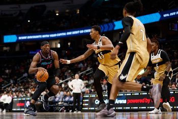 Apr 10, 2026; Washington, District of Columbia, USA; Miami Heat center Bam Adebayo (13) drives to the basket as Washington Wizards forward Julian Reese (15) defends in the first half at Capital One Arena. Mandatory Credit: Geoff Burke-Imagn Images