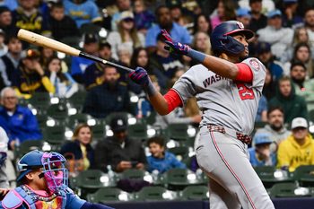 Apr 10, 2026; Milwaukee, Wisconsin, USA; Washington Nationals right fielder James Wood (29) hits a double to drive in a run in the ninth inning against the Milwaukee Brewers  at American Family Field. Mandatory Credit: Benny Sieu-Imagn Images