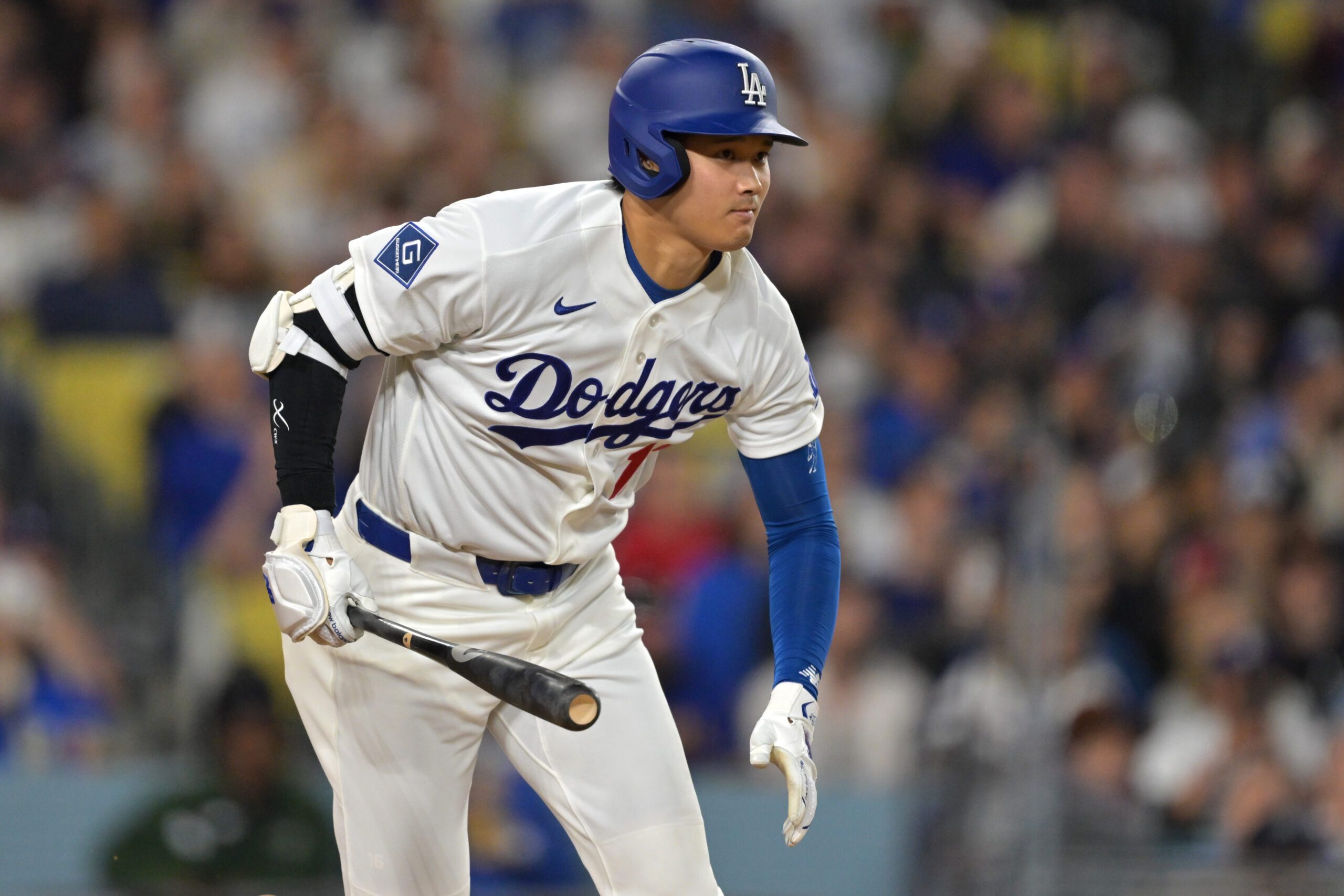 Apr 10, 2026; Los Angeles, California, USA; Los Angeles Dodgers two-way player Shohei Ohtani (17) singles in the fifth inning against the Texas Rangers at Dodger Stadium. Mandatory Credit: Jayne Kamin-Oncea-Imagn Images