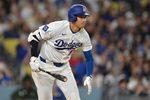 Apr 10, 2026; Los Angeles, California, USA; Los Angeles Dodgers two-way player Shohei Ohtani (17) singles in the fifth inning against the Texas Rangers at Dodger Stadium. Mandatory Credit: Jayne Kamin-Oncea-Imagn Images