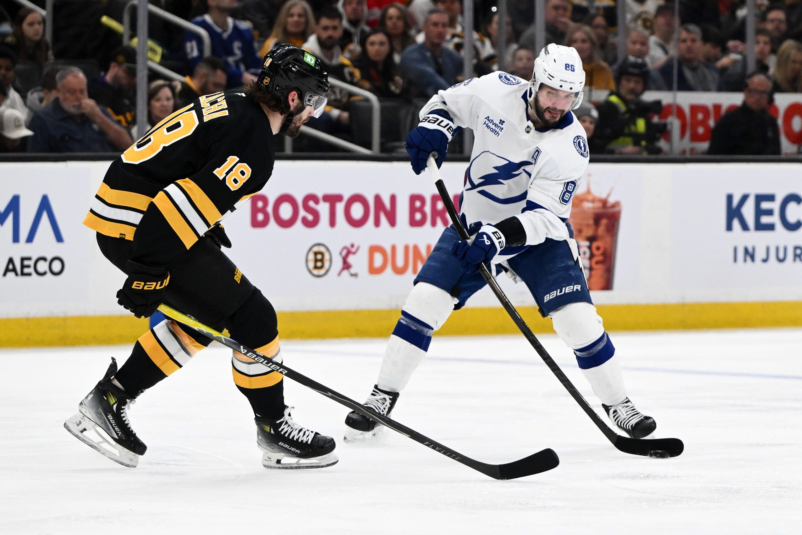 Apr 11, 2026; Boston, Massachusetts, USA; Tampa Bay Lightning right wing Nikita Kucherov (86) attempts a shot against Boston Bruins center Pavel Zacha (18) during the second period at the TD Garden. Mandatory Credit: Brian Fluharty-Imagn Images