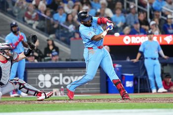 Apr 11, 2026; Toronto, Ontario, CAN; Toronto Blue Jays first baseman Vladimir Guerrero Jr. (27) hits a single against the Minnesota Twins during the ninth inning at Rogers Centre. Mandatory Credit: Nick Turchiaro-Imagn Images