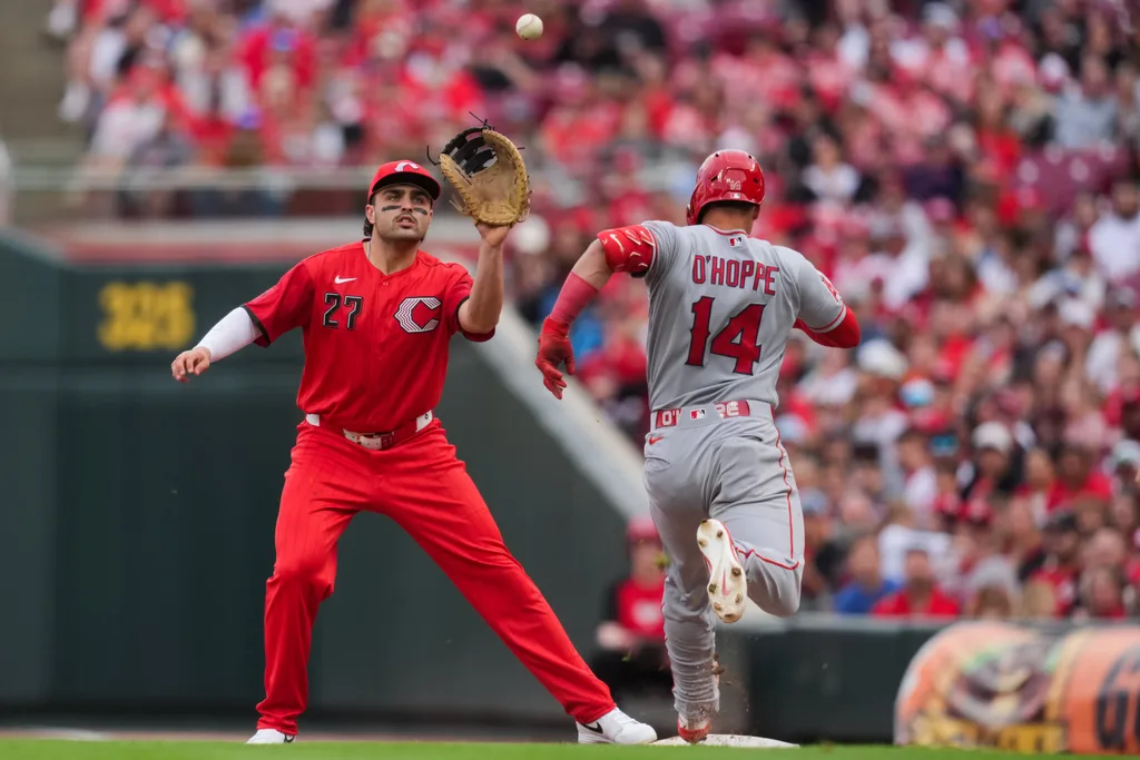 Apr 11, 2026; Cincinnati, Ohio, USA; Cincinnati Reds third baseman Sal Stewart (27) fields the ball as Los Angeles Angels catcher Logan O'Hoppe (14) attempts to run to first base after striking out in the eighth inning at Great American Ball Park. Logan O’Hoppe was called out for batter interference. Mandatory Credit: Aaron Doster-Imagn Images
