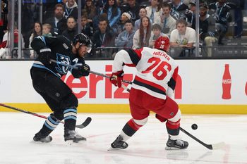 Apr 11, 2026; Salt Lake City, Utah, USA; Utah Mammoth left wing Lawson Crouse (67) takes a shot against Carolina Hurricanes defenseman Skyler Brind'Amour (76) during the third period at Delta Center. Mandatory Credit: Rob Gray-Imagn Images