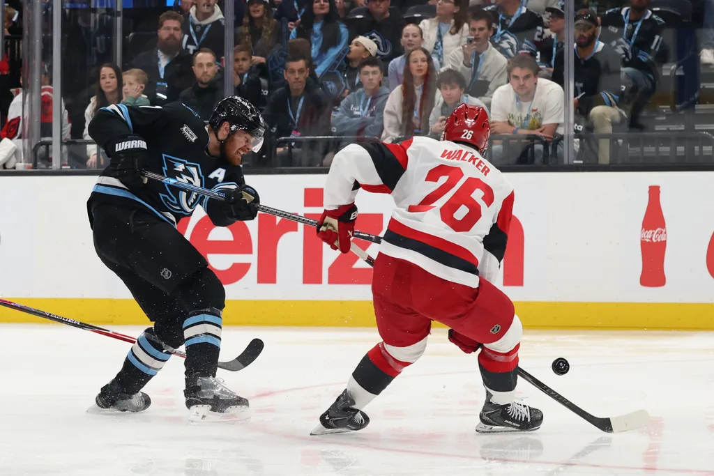 Apr 11, 2026; Salt Lake City, Utah, USA; Utah Mammoth left wing Lawson Crouse (67) takes a shot against Carolina Hurricanes defenseman Skyler Brind'Amour (76) during the third period at Delta Center. Mandatory Credit: Rob Gray-Imagn Images