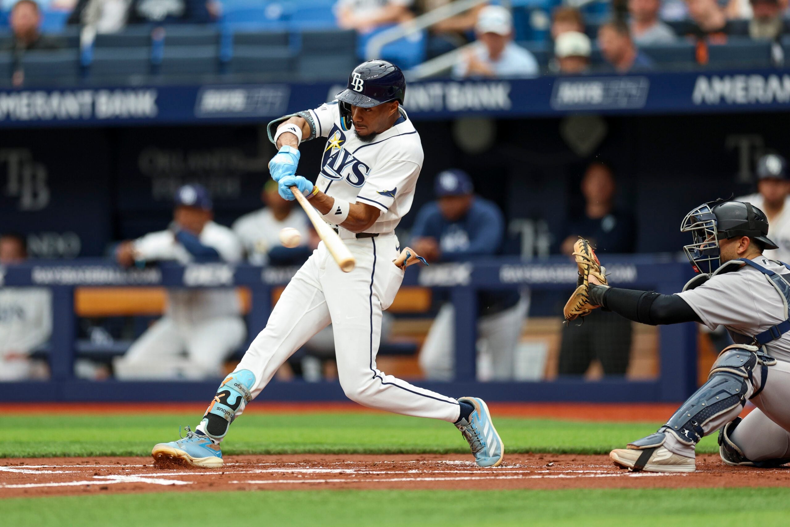 Apr 12, 2026; St. Petersburg, Florida, USA; Tampa Bay Rays left fielder Chandler Simpson (14) singles against the New York Yankees in the first inning at Tropicana Field. Mandatory Credit: Nathan Ray Seebeck-Imagn Images