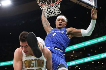 Apr 12, 2026; Boston, Massachusetts, USA; Orlando Magic forward Paolo Banchero (5) dunks the ball during the first half against the Boston Celtics at TD Garden. Mandatory Credit: Paul Rutherford-Imagn Images