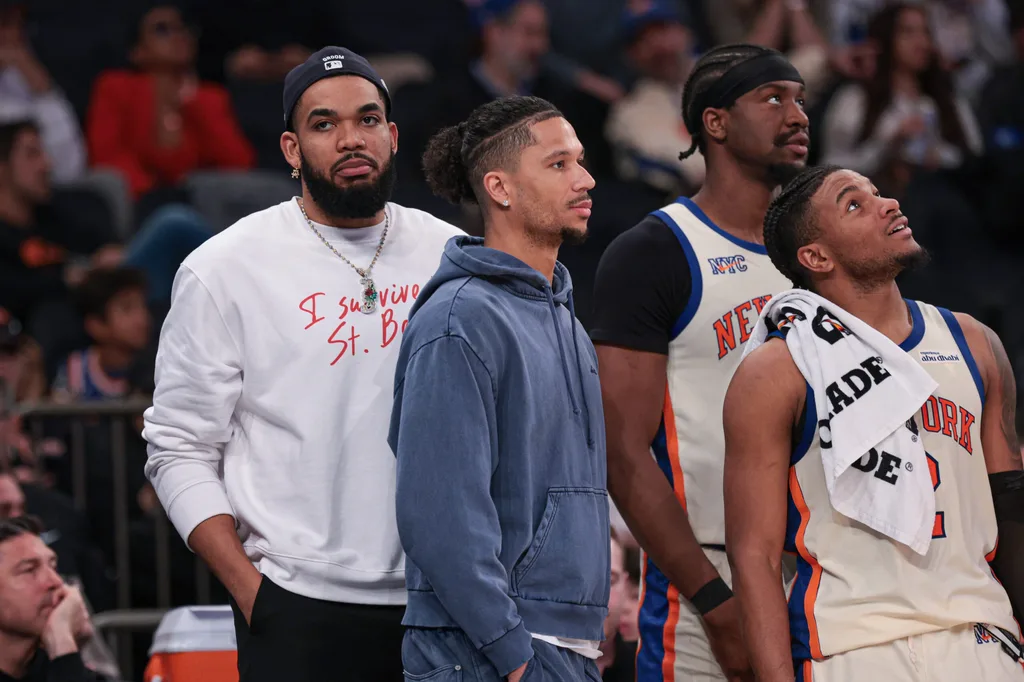 Apr 12, 2026; New York, New York, USA; New York Knicks center Karl-Anthony Towns, far left, and Josh Hart, center-left look on with center Ariel Hukporti (55) and guard Miles McBride (2) during the second half against the Charlotte Hornets at Madison Square Garden. Mandatory Credit: Vincent Carchietta-Imagn Images