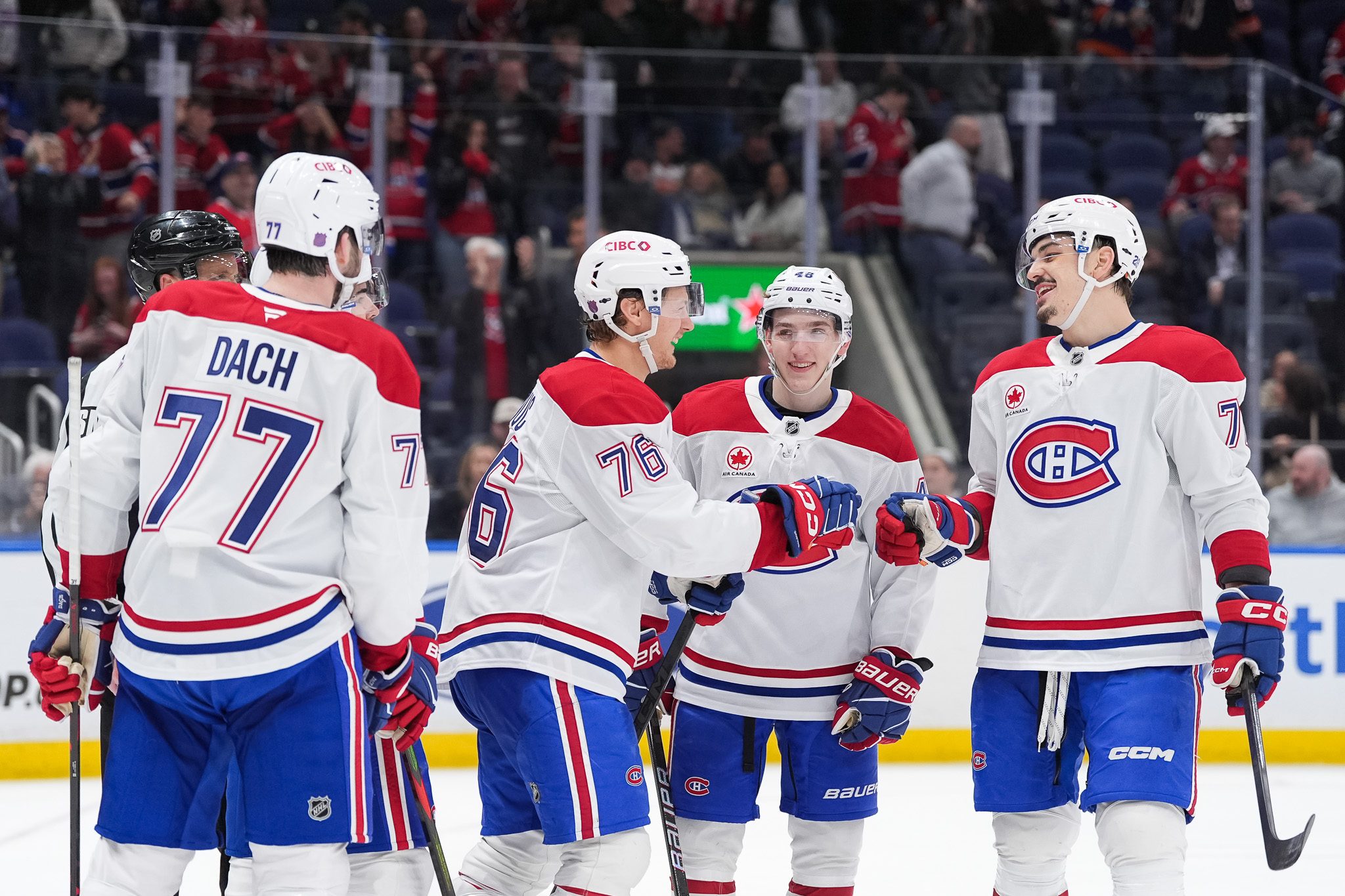 Apr 12, 2026; Elmont, New York, USA; Montreal Canadiens right wing Zachary Bolduc (76) celebrates a third period goal with center Kirby Dach (77), defenseman Lane Hutson (48) and defenseman Arber Xhekaj (72) at UBS Arena. Mandatory Credit: Alexander Wohl-Imagn Images