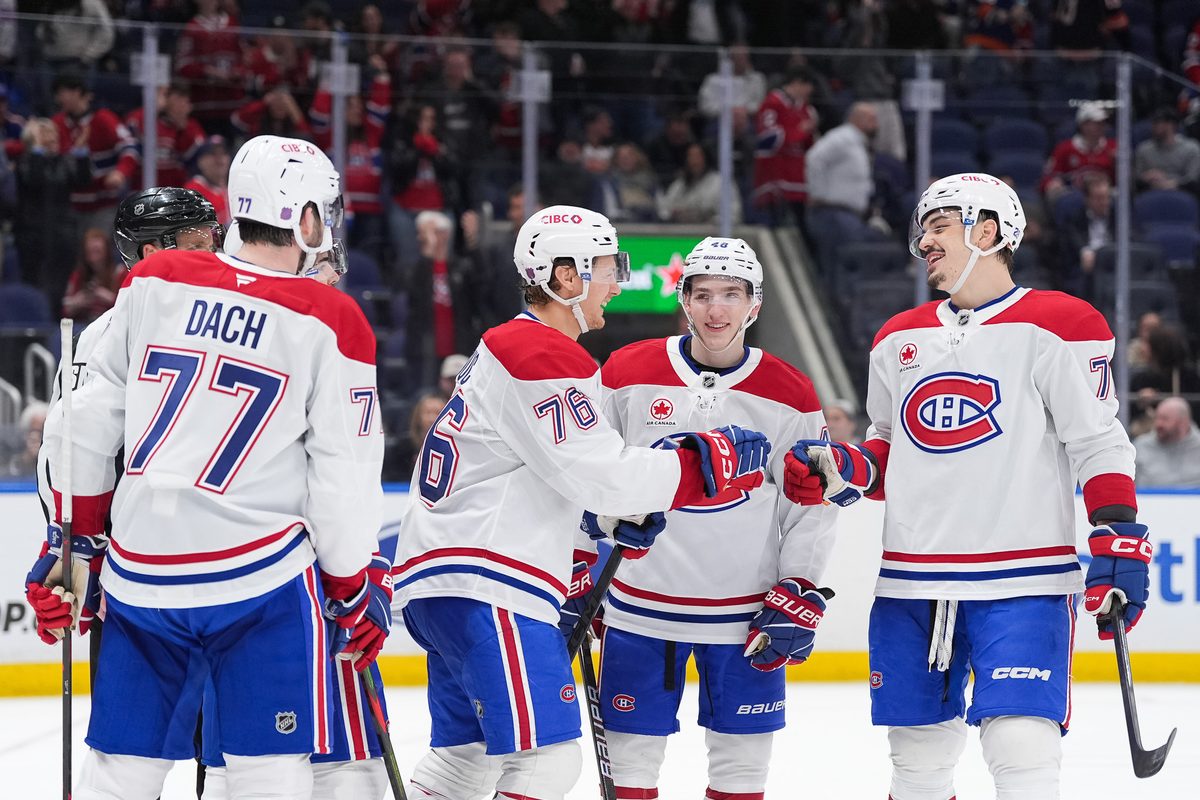 Apr 12, 2026; Elmont, New York, USA; Montreal Canadiens right wing Zachary Bolduc (76) celebrates a third period goal with center Kirby Dach (77), defenseman Lane Hutson (48) and defenseman Arber Xhekaj (72) at UBS Arena. Mandatory Credit: Alexander Wohl-Imagn Images