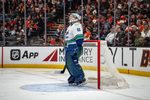 Apr 12, 2026; Anaheim, California, USA;  Vancouver Canucks goaltender Nikita Tolopilo (60) watches a replay during the second period against the Anaheim Ducks at Honda Center. Mandatory Credit: Corinne Votaw-Imagn Images