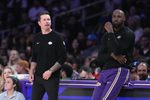 Apr 12, 2026; Los Angeles, California; Los Angeles Lakers head coach JJ Redick (left) and forward LeBron James (23) watch against the Utah Jazz in the first half at Crypto.com Arena. Mandatory Credit: Kirby Lee-Imagn Images