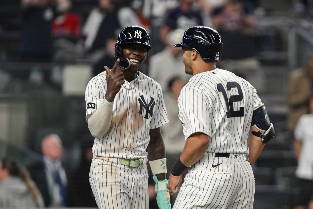 Apr 13, 2026; Bronx, New York, USA; New York Yankees center fielder Trent Grisham (12) celebrates with second baseman Jazz Chisholm Jr. (13) after hitting a two run home run against the Los Angeles Angels during the ninth inning at Yankee Stadium. Mandatory Credit: John Jones-Imagn Images
