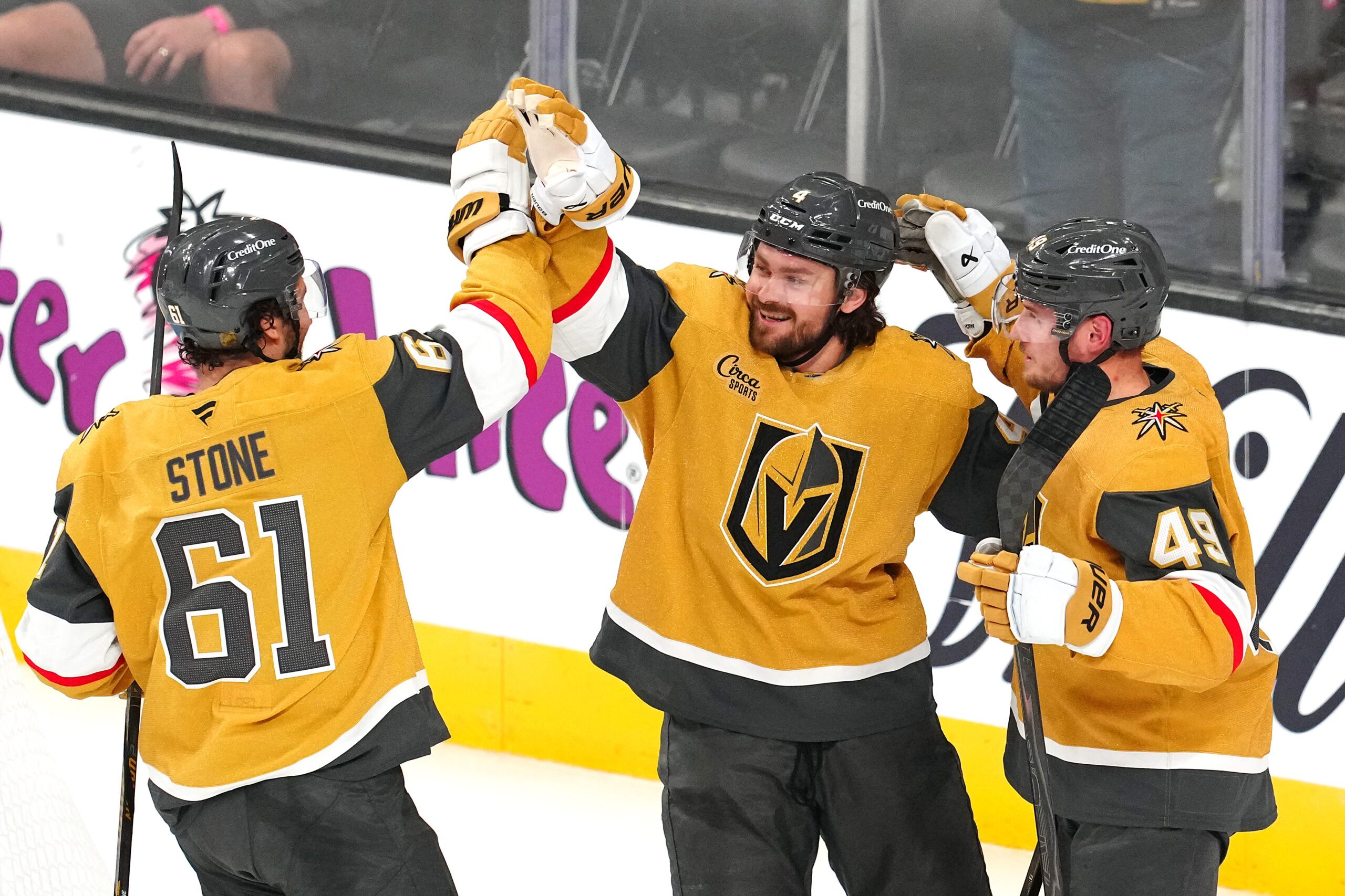 Apr 13, 2026; Las Vegas, Nevada, USA; Vegas Golden Knights defenseman Rasmus Andersson (4) celebrates with  right wing Mark Stone (61) and left wing Ivan Barbashev (49) after scoring a goal against the Winnipeg Jets during the third period at T-Mobile Arena. Mandatory Credit: Stephen R. Sylvanie-Imagn Images