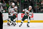 Apr 9, 2026; Dallas, Texas, USA; Minnesota Wild left wing Kirill Kaprizov (97) and left wing Matt Boldy (12) and right wing Ryan Hartman (38) celebrates a goal scored by Kaprizov during the game between the Stars and the Wild at American Airlines Center. Mandatory Credit: Jerome Miron-Imagn Images