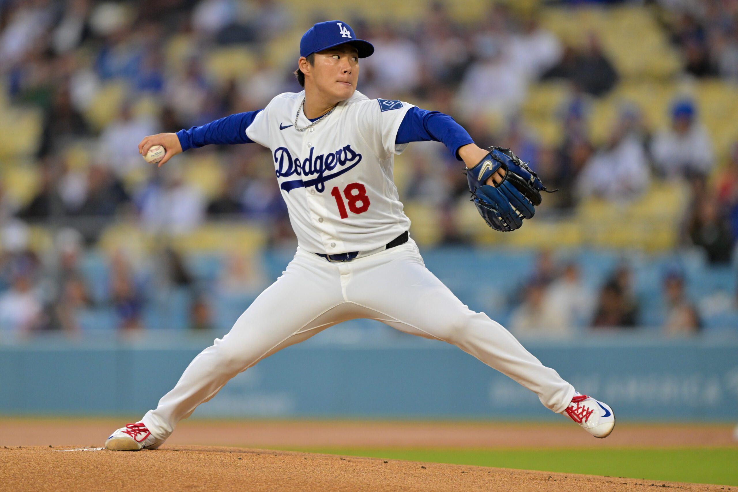 Apr 14, 2026; Los Angeles, California, USA; Los Angeles Dodgers pitcher Yoshinobu Yamamoto (18) throws a pitch against the New York Mets during the first inning at Dodger Stadium. Mandatory Credit: Jayne Kamin-Oncea-Imagn Images