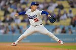 Apr 14, 2026; Los Angeles, California, USA; Los Angeles Dodgers pitcher Yoshinobu Yamamoto (18) throws a pitch against the New York Mets during the first inning at Dodger Stadium. Mandatory Credit: Jayne Kamin-Oncea-Imagn Images