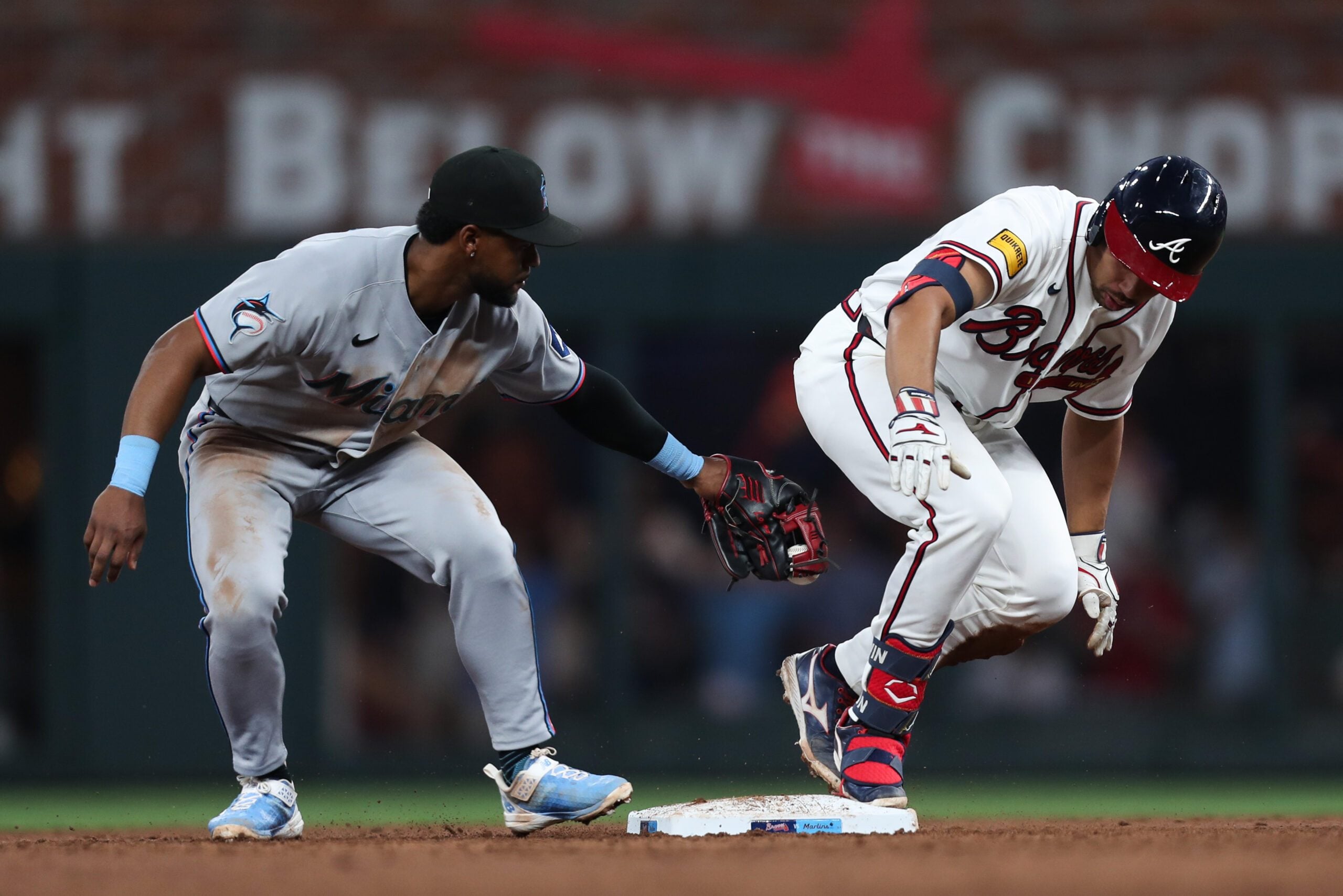 Apr 14, 2026; Cumberland, Georgia, USA; Atlanta Braves catcher Drake Baldwin (30) is safe on second base next to Miami Marlins shortstop Xavier Edwards (9) in the third inning at Truist Park. Mandatory Credit: Mady Mertens-Imagn Images
