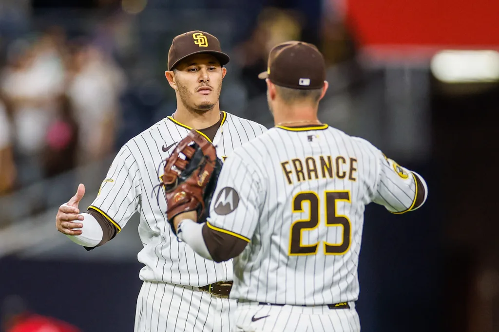 Apr 14, 2026; San Diego, California, USA; San Diego Padres third baseman Manny Machado (13) celebrates with first baseman Ty France (25) after defeating the Seattle Mariners at Petco Park. Mandatory Credit: David Frerker-Imagn Images