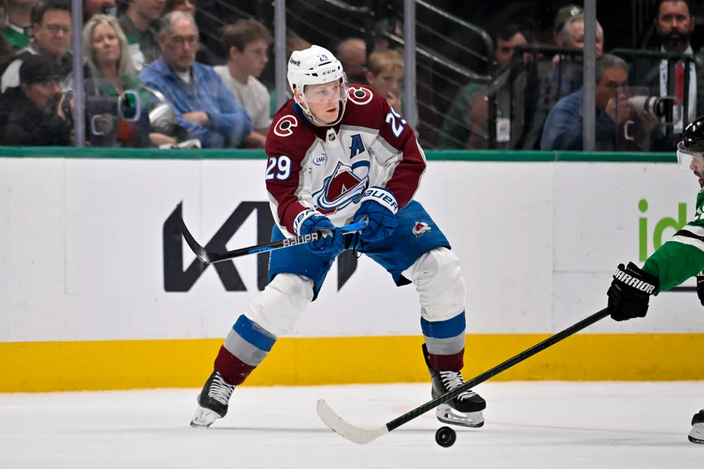 Apr 4, 2026; Dallas, Texas, USA; Colorado Avalanche center Nathan MacKinnon (29) skates against the Dallas Stars during the game between the Stars and the Avalanche at American Airlines Center. Mandatory Credit: Jerome Miron-Imagn Images