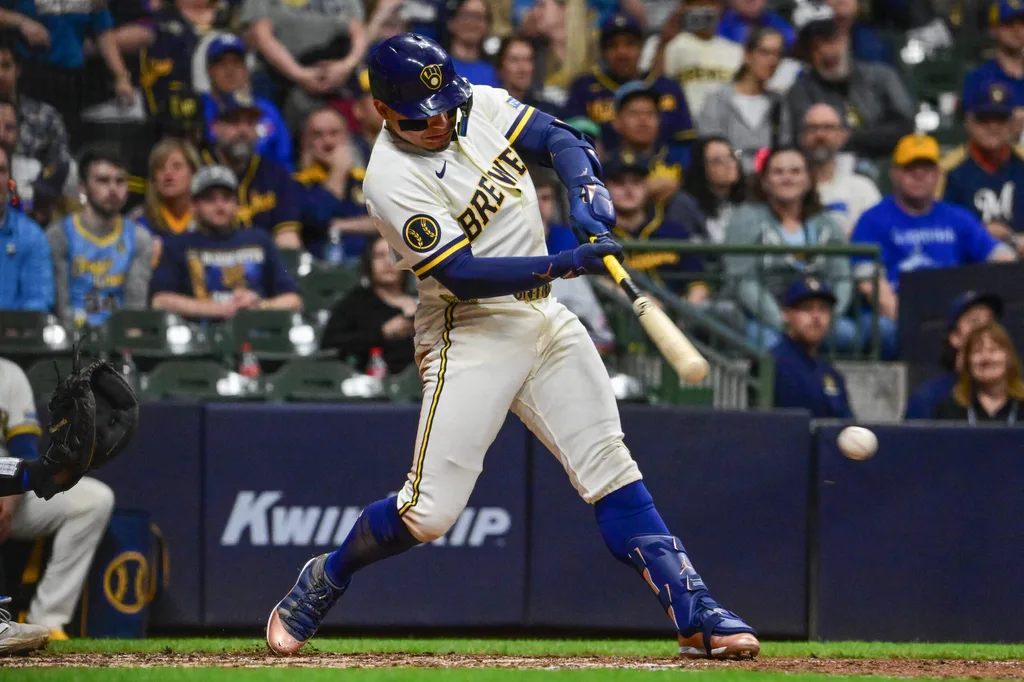 Apr 15, 2026; Milwaukee, Wisconsin, USA; Milwaukee Brewers designated hitter William Contreras (24) hits a single to drive in a run in the eighth inning against the Toronto Blue Jays at American Family Field. Mandatory Credit: Benny Sieu-Imagn Images