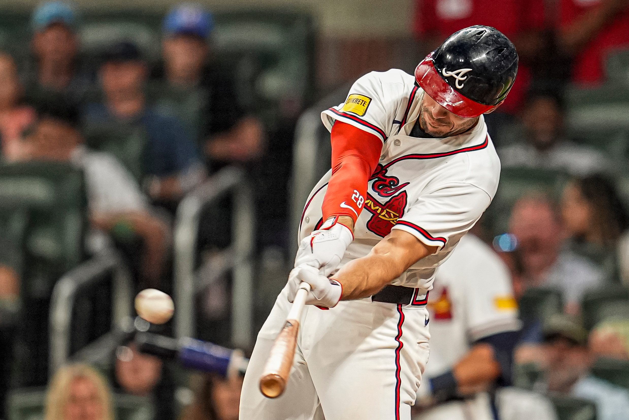 Apr 15, 2026; Cumberland, Georgia, USA; Atlanta Braves first baseman Matt Olson (28) hits a home run against the Miami Marlins during the seventh inning at Truist Park. All players are wearing number 42 today in honor of Jackie Robinson. Mandatory Credit: Dale Zanine-Imagn Images