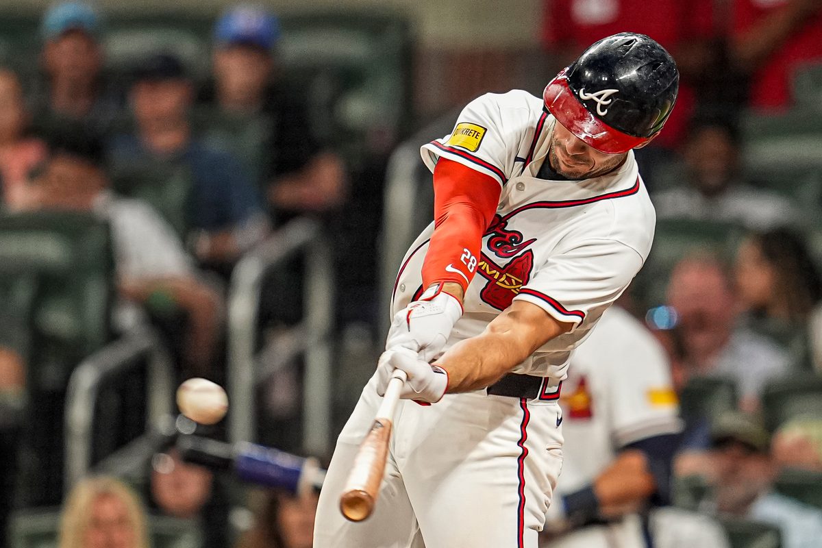 Apr 15, 2026; Cumberland, Georgia, USA; Atlanta Braves first baseman Matt Olson (28) hits a home run against the Miami Marlins during the seventh inning at Truist Park. All players are wearing number 42 today in honor of Jackie Robinson. Mandatory Credit: Dale Zanine-Imagn Images