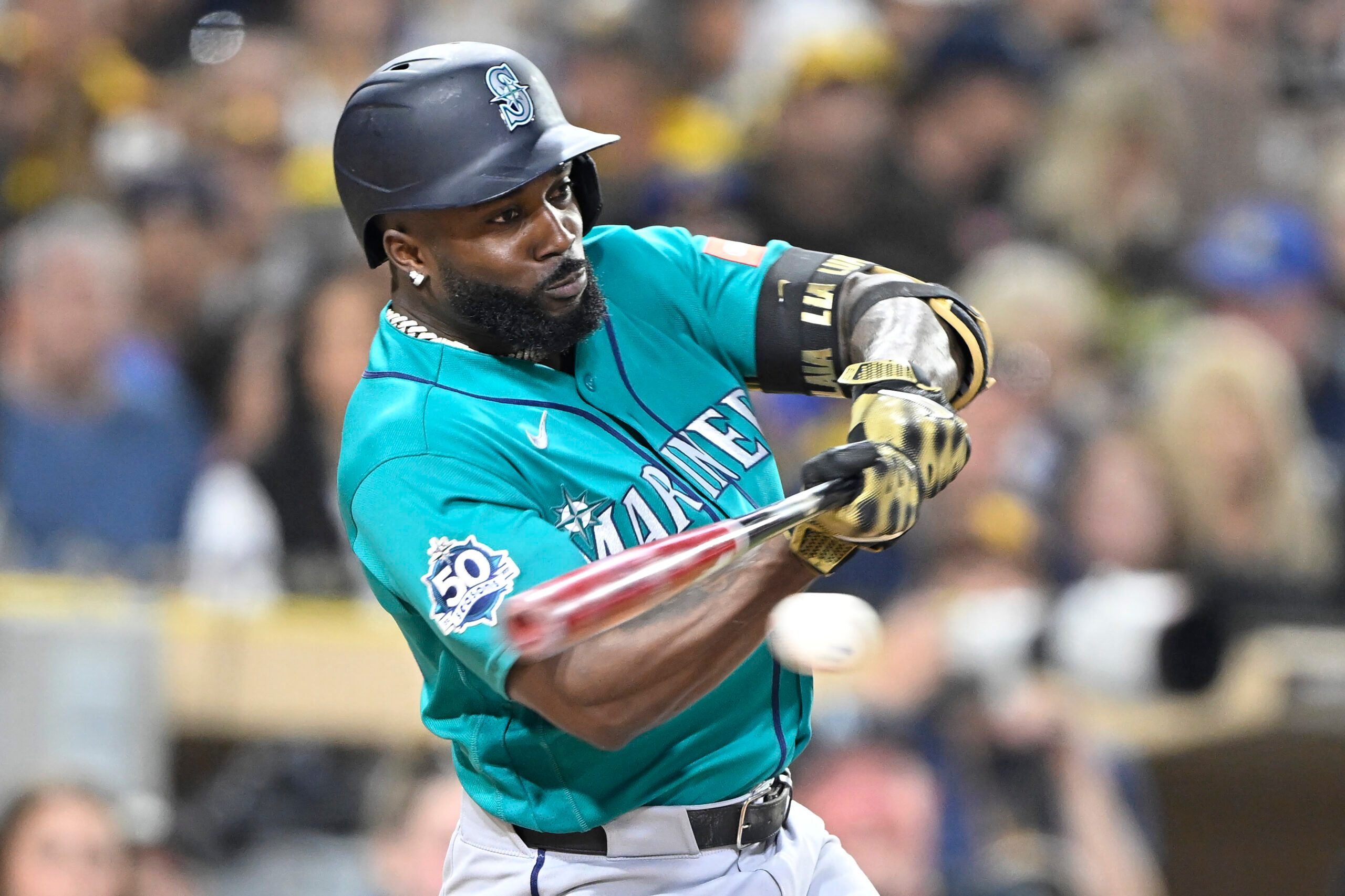 Apr 15, 2026; San Diego, California, USA; Seattle Mariners left fielder Randy Arozarena hits a single during the fifth inning against the San Diego Padres at Petco Park. All MLB players are wearing number 42 today to honor Jackie Robinson. Mandatory Credit: Denis Poroy-Imagn Images