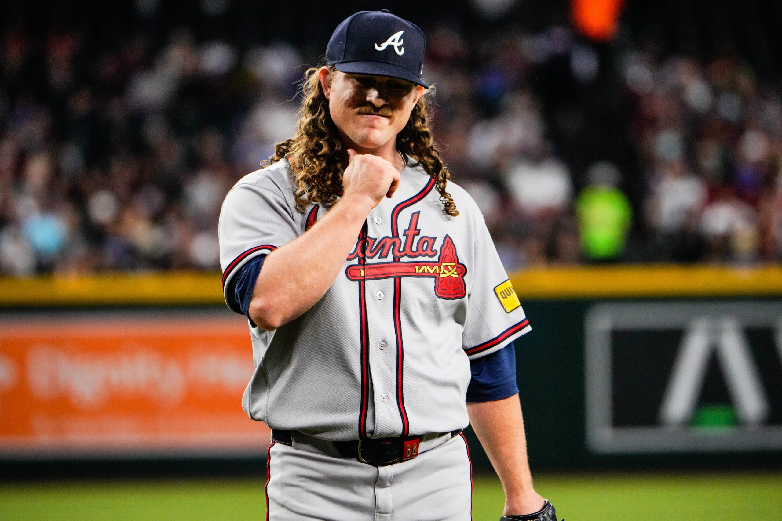 Apr 3, 2026; Phoenix, Arizona, USA; Atlanta Braves pitcher Grant Holmes (66) walks off the mound at the end first inning at Chase Field. Mandatory Credit: Arianna Grainey-Imagn Images