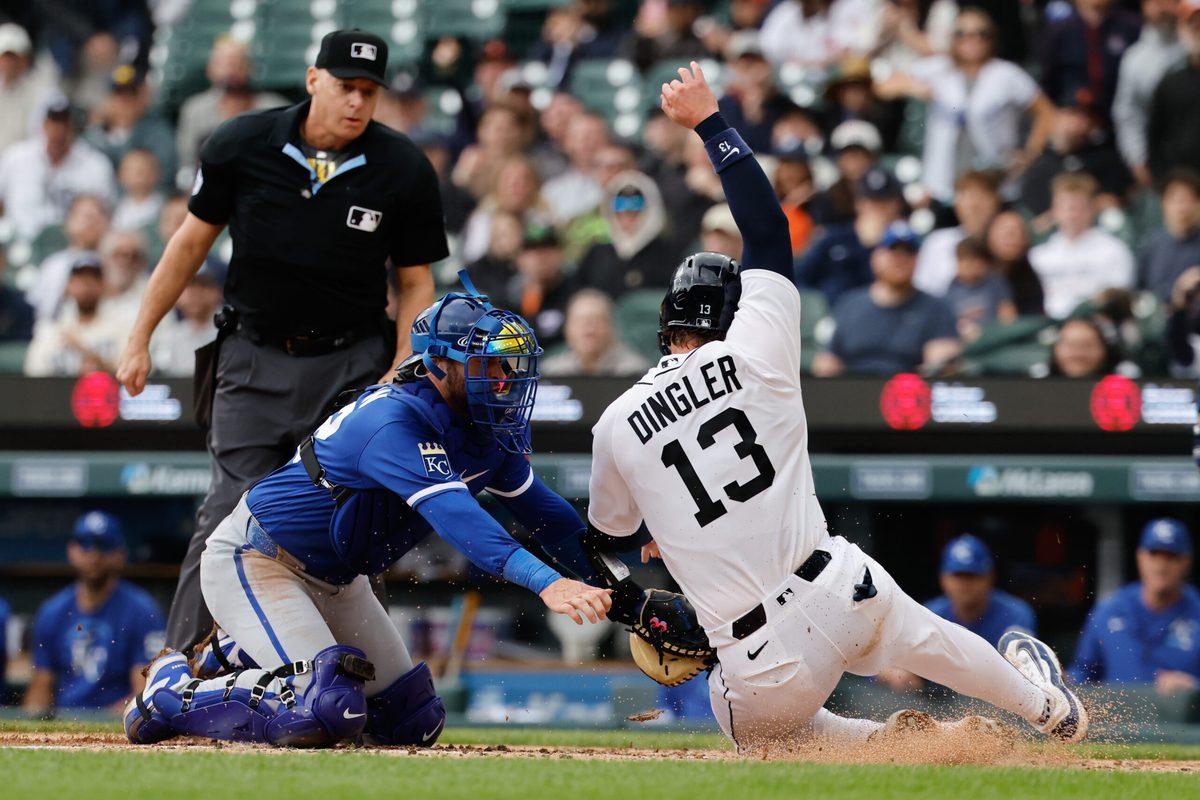 Apr 16, 2026; Detroit, Michigan, USA; Kansas City Royals catcher Carter Jensen (22) tags Detroit Tigers catcher Dillon Dingler (13) out at home in the fourth inning at Comerica Park. Mandatory Credit: Rick Osentoski-Imagn Images