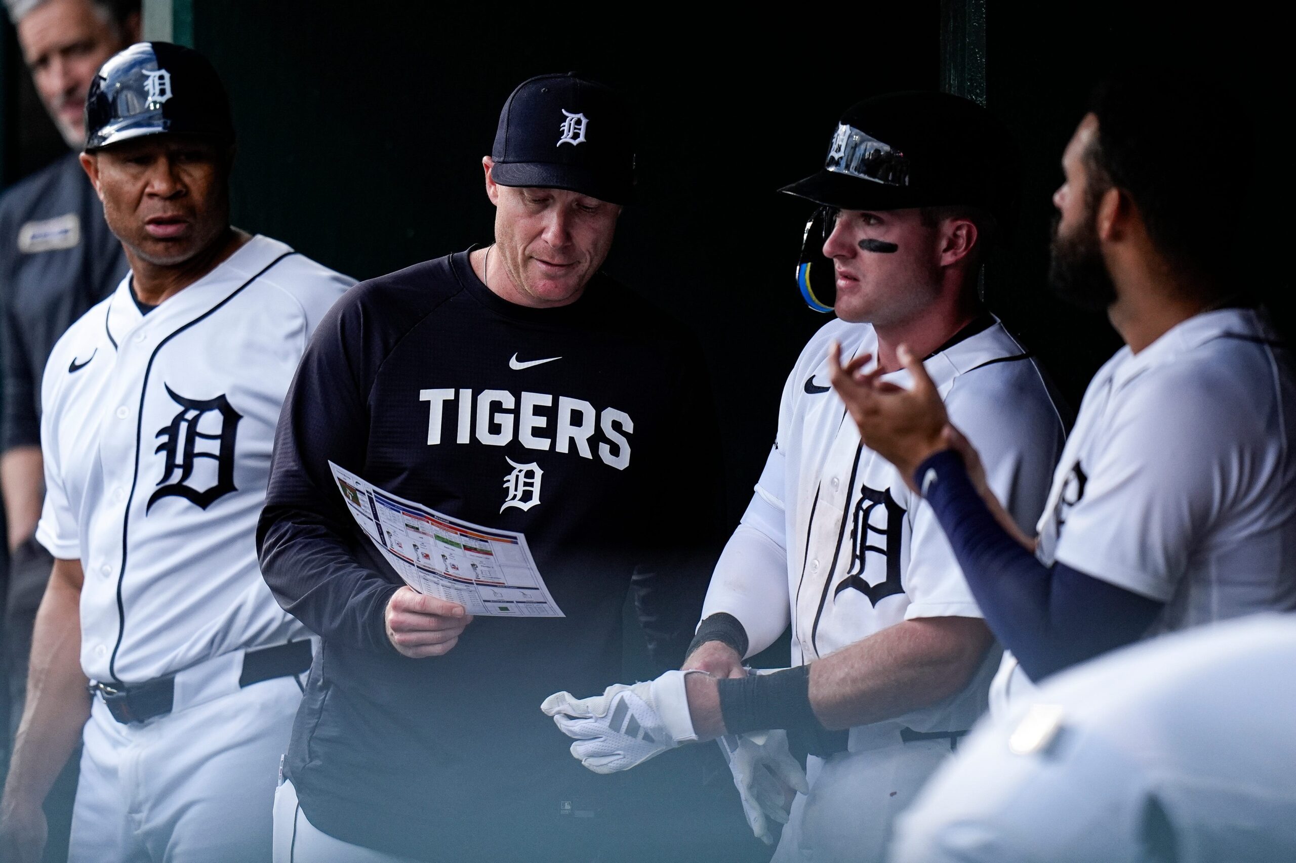 Detroit Tigers assistant hitting coach Cody Asche (92), left, talks to third baseman Kevin McGonigle (7) during the ninth inning against Kansas City Royals at Comerica Park in Detroit on Thursday, April 16, 2026.