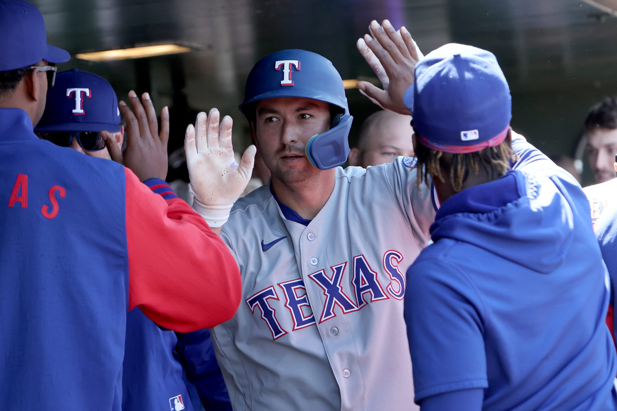 Apr 16, 2026; West Sacramento, California, USA; Texas Rangers catcher Kyle Higashioka (11) celebrates with teammates after scoring a run against the Athletics during the ninth inning at Sutter Health Park. Mandatory Credit: Dennis Lee-Imagn Images