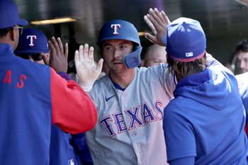 Apr 16, 2026; West Sacramento, California, USA; Texas Rangers catcher Kyle Higashioka (11) celebrates with teammates after scoring a run against the Athletics during the ninth inning at Sutter Health Park. Mandatory Credit: Dennis Lee-Imagn Images