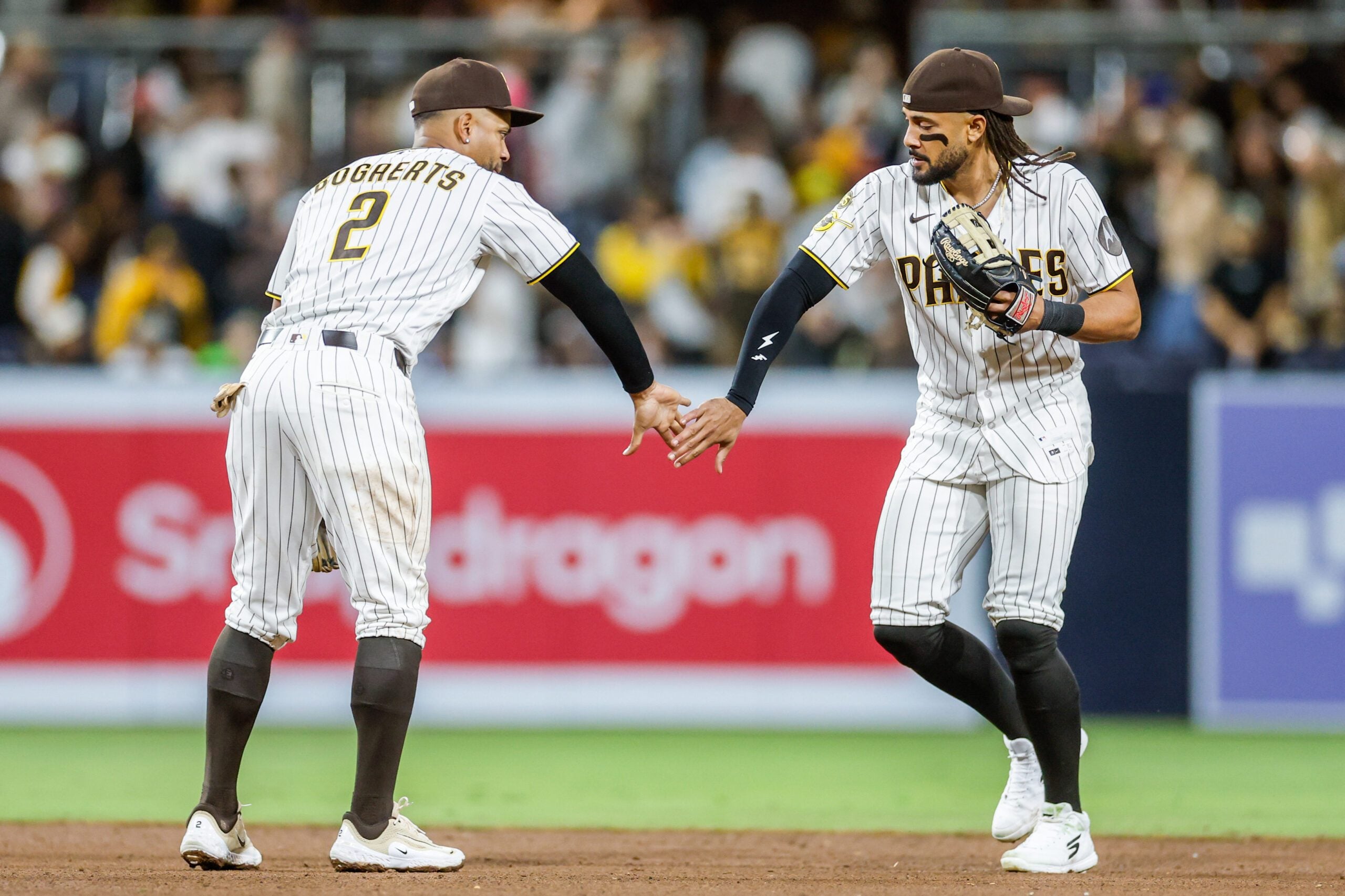 Apr 16, 2026; San Diego, California, USA; San Diego Padres shortstop Xander Bogaerts (2) celebrates with right fielder Fernando Tatis Jr. (23) after defeating the Seattle Mariners at Petco Park. Mandatory Credit: David Frerker-Imagn Images