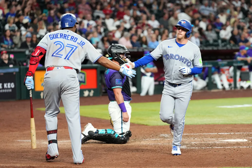 Apr 17, 2026; Phoenix, Arizona, USA; Toronto Blue Jays center fielder Myles Straw (3) slaps hands with Toronto Blue Jays first baseman Vladimir Guerrero Jr. (27) after hitting a solo home run against the Arizona Diamondbacks during the sixth inning at Chase Field. Mandatory Credit: Joe Camporeale-Imagn Images