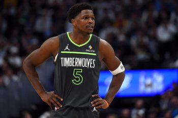 Apr 18, 2026; Denver, Colorado, USA; Minnesota Timberwolves guard Anthony Edwards (5) looks on during the first half against the Denver Nuggets in game one of the first round of the 2026 NBA Playoffs at Ball Arena. Mandatory Credit: Christopher Hanewinckel-Imagn Images