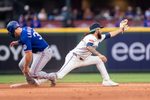 Apr 18, 2026; Seattle, Washington, USA; Texas Rangers left fielder Wyatt Langford (36) slides safely into second base ahead of a throw to Seattle Mariners shortstop J.P. Crawford (3) during the ninth inning at T-Mobile Park. Mandatory Credit: Stephen Brashear-Imagn Images