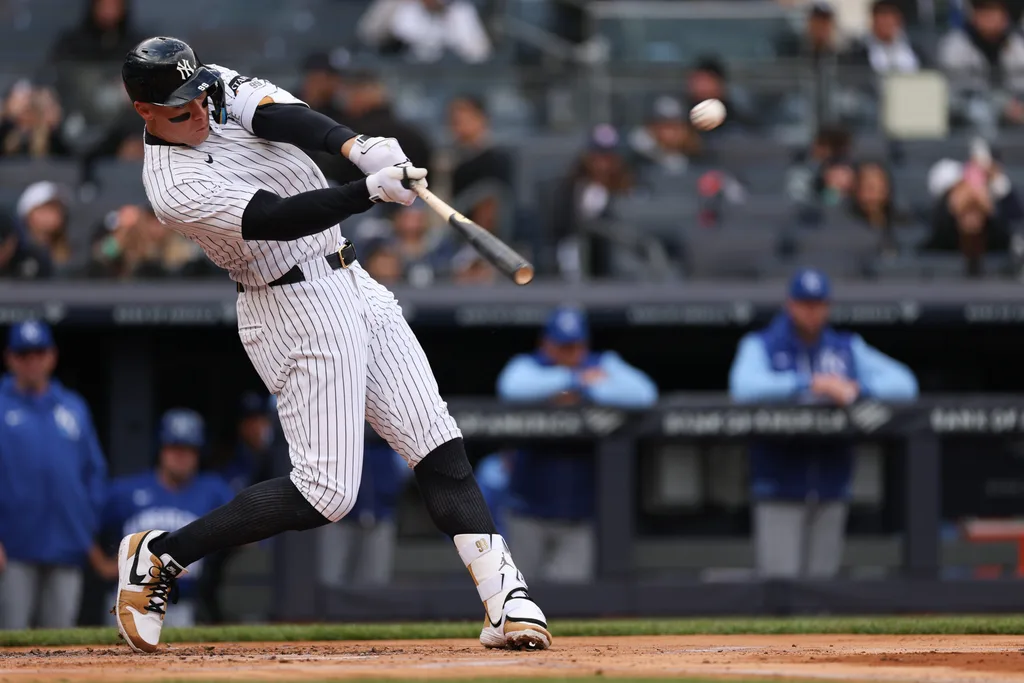 Apr 19, 2026; Bronx, New York, USA; New York Yankees right fielder Aaron Judge (99) hits a two run home run during the first inning against the Kansas City Royals at Yankee Stadium. Mandatory Credit: Vincent Carchietta-Imagn Images