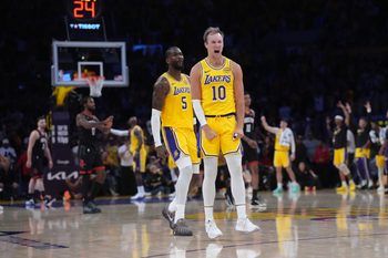 Apr 18, 2026; Los Angeles, California, USA; Los Angeles Lakers guard Luke Kennard (10) and center Deandre Ayton (5) celebrate against the Houston Rockets in the second half during game one of the first round of the 2026 NBA Playoffs at Crypto.com Arena. Mandatory Credit: Kirby Lee-Imagn Images