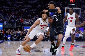 Apr 19, 2026; Detroit, Michigan, USA; Detroit Pistons guard Cade Cunningham (2) dribbles defended by Orlando Magic forward Paolo Banchero (5) in the second half during the 2026 NBA Playoffs at Little Caesars Arena. Mandatory Credit: Rick Osentoski-Imagn Images