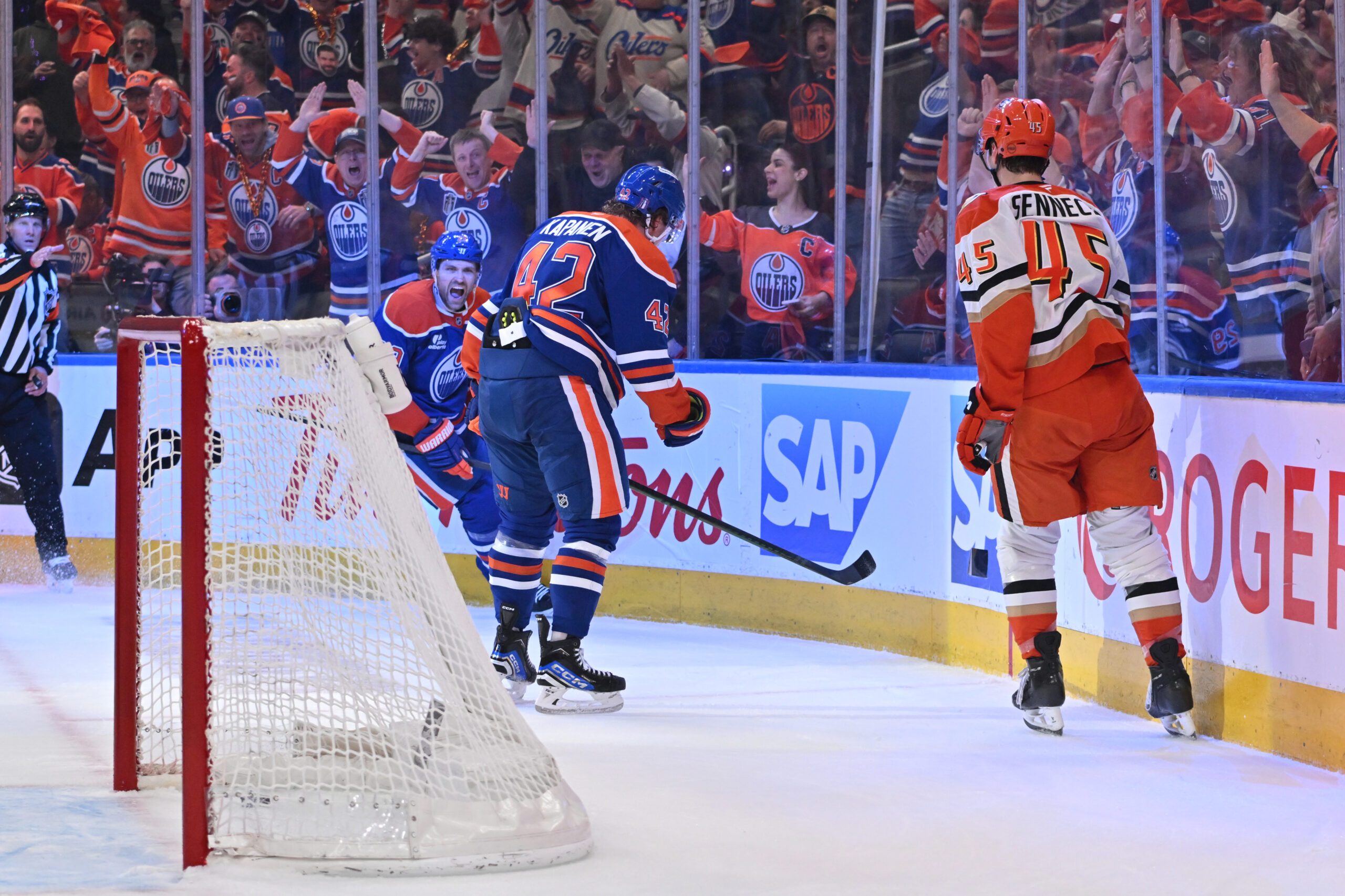 Apr 20, 2026; Edmonton, Alberta, CAN; Edmonton Oilers center Leon Draisaitl (29)  with right winger Kasperi Kapanen (42) celebrate a goal as Anaheim Ducks right winger Beckett Sennecke (45) skates past in game one of the first round of the 2026 Stanley Cup Playoffs during the first period at Rogers Place. Mandatory Credit: Walter Tychnowicz-Imagn Images