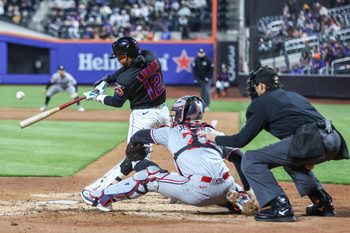 Apr 21, 2026; New York City, New York, USA;  New York Mets shortstop Francisco Lindor (12) hits a three-run home run in the third inning against the Minnesota Twins at Citi Field. Mandatory Credit: Wendell Cruz-Imagn Images