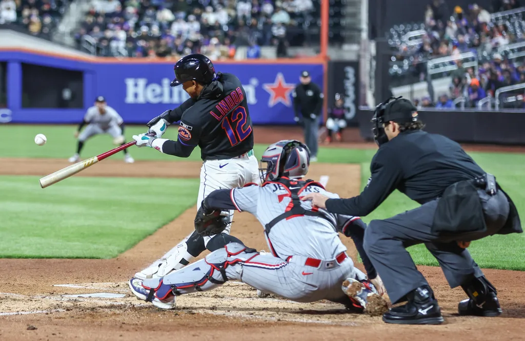 Apr 21, 2026; New York City, New York, USA; New York Mets shortstop Francisco Lindor (12) hits a three-run home run in the third inning against the Minnesota Twins at Citi Field. Mandatory Credit: Wendell Cruz-Imagn Images