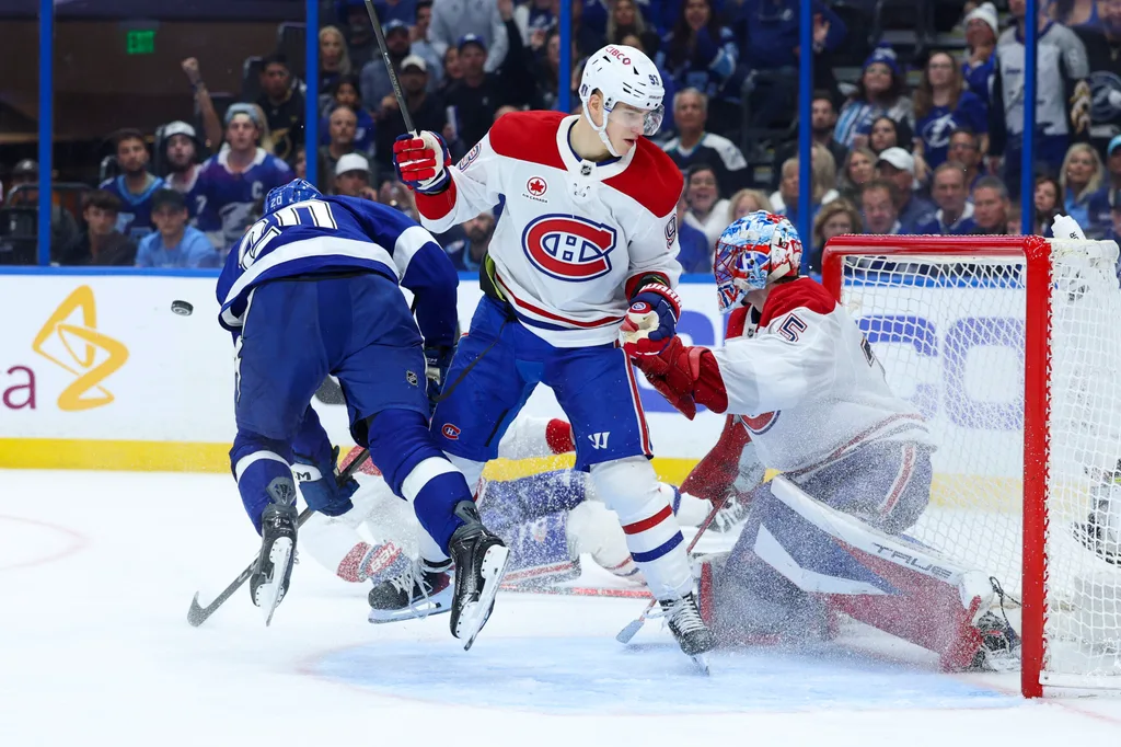 Apr 21, 2026; Tampa, Florida, USA; Tampa Bay Lightning left wing Nick Paul (20) is tipped up in front of the goal by Montreal Canadiens right wing Ivan Demidov (93) in the third period during game two of the first round of the 2026 Stanley Cup Playoffs at Benchmark International Arena. Mandatory Credit: Nathan Ray Seebeck-Imagn Images
