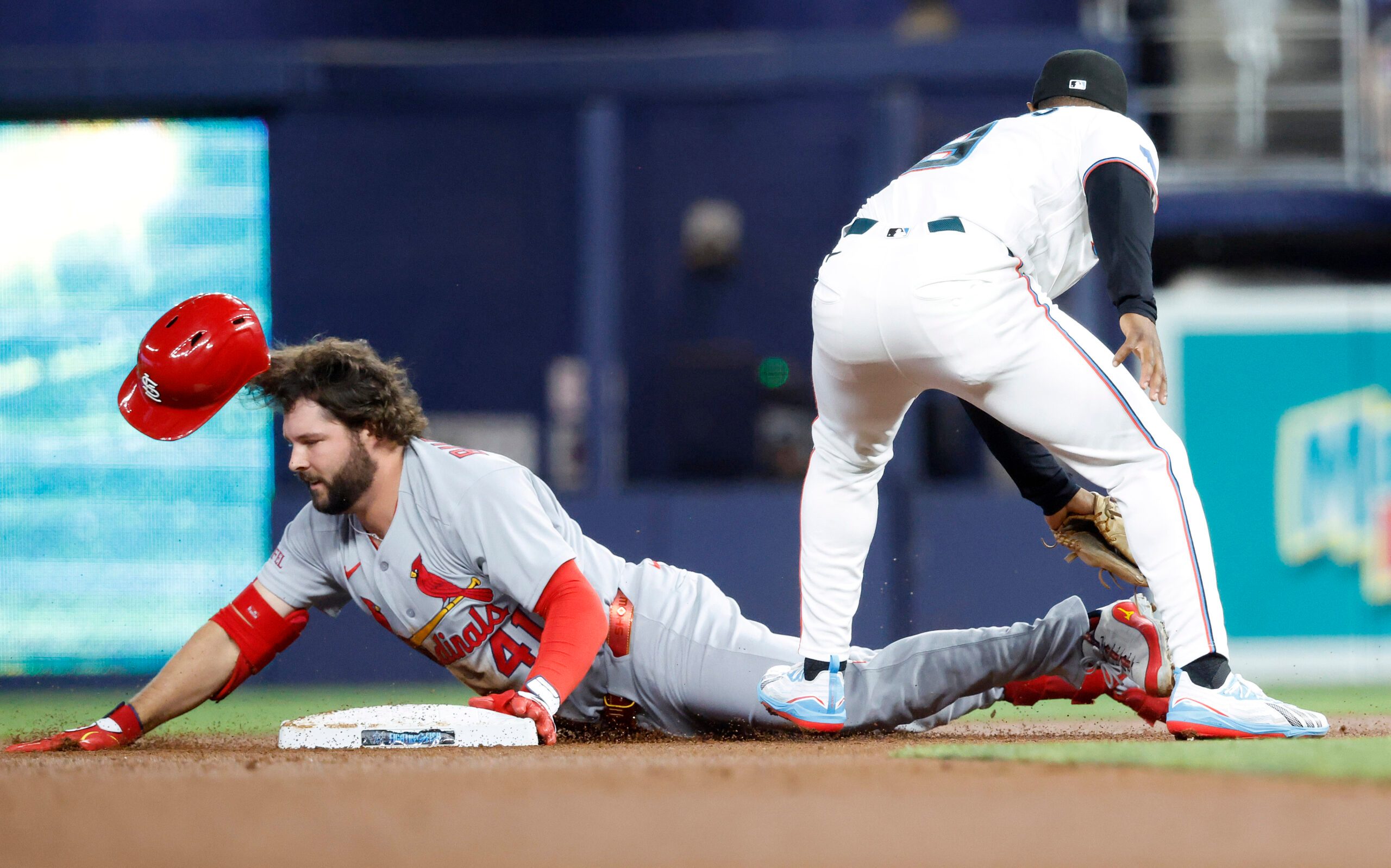 Apr 21, 2026; Miami, Florida, USA;  St. Louis Cardinals first baseman Alec Burleson (41) slides into second base against the Miami Marlins during the first inning at loanDepot Park. Mandatory Credit: Rhona Wise-Imagn Images