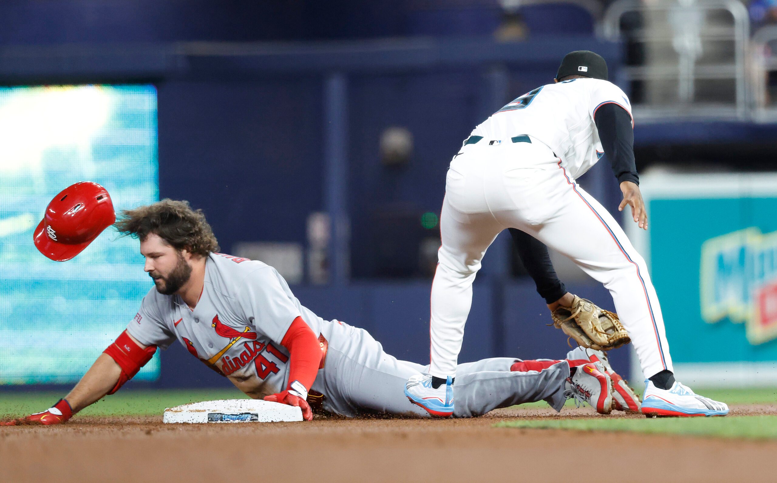 Apr 21, 2026; Miami, Florida, USA;  St. Louis Cardinals first baseman Alec Burleson (41) slides into second base against the Miami Marlins during the first inning at loanDepot Park. Mandatory Credit: Rhona Wise-Imagn Images