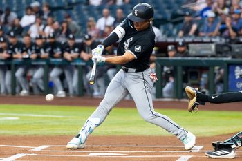 Apr 21, 2026; Phoenix, Arizona, USA; Chicago White Sox first baseman Munetaka Murakami (5) hits a single against the Arizona Diamondbacks in the first inning at Chase Field. Mandatory Credit: Mark J. Rebilas-Imagn Images