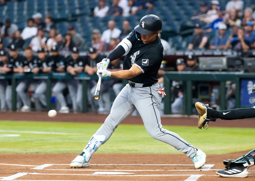 Apr 21, 2026; Phoenix, Arizona, USA; Chicago White Sox first baseman Munetaka Murakami (5) hits a single against the Arizona Diamondbacks in the first inning at Chase Field. Mandatory Credit: Mark J. Rebilas-Imagn Images